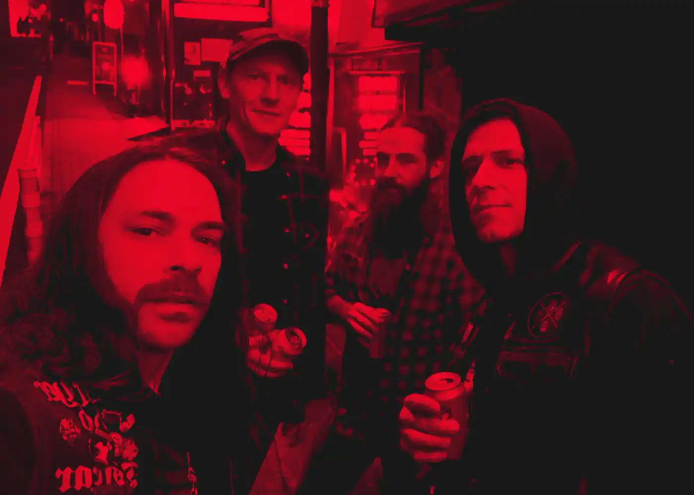 Worship Pain band members together under red light