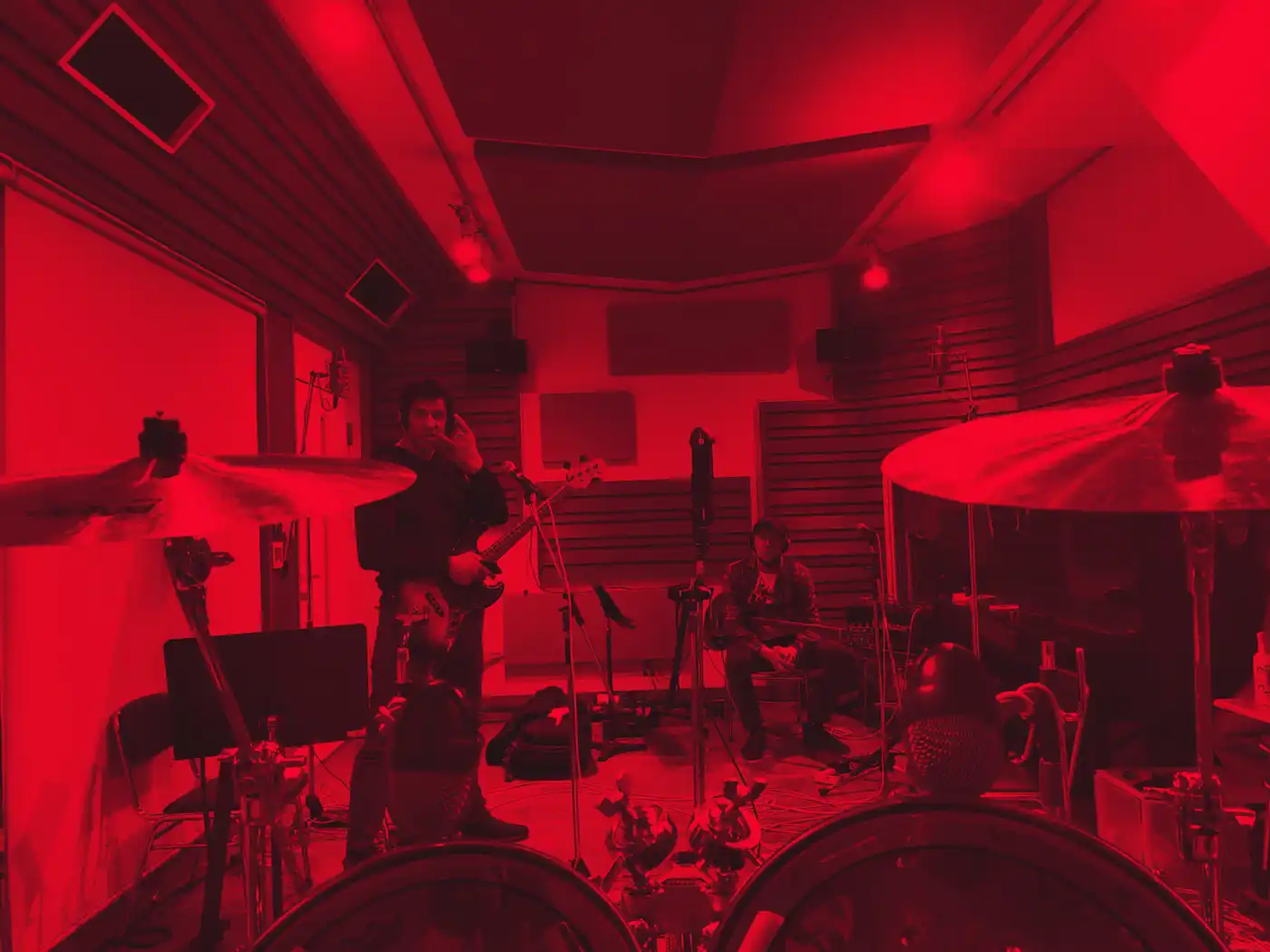 Worship Pain in a rehearsal room flooded with red light